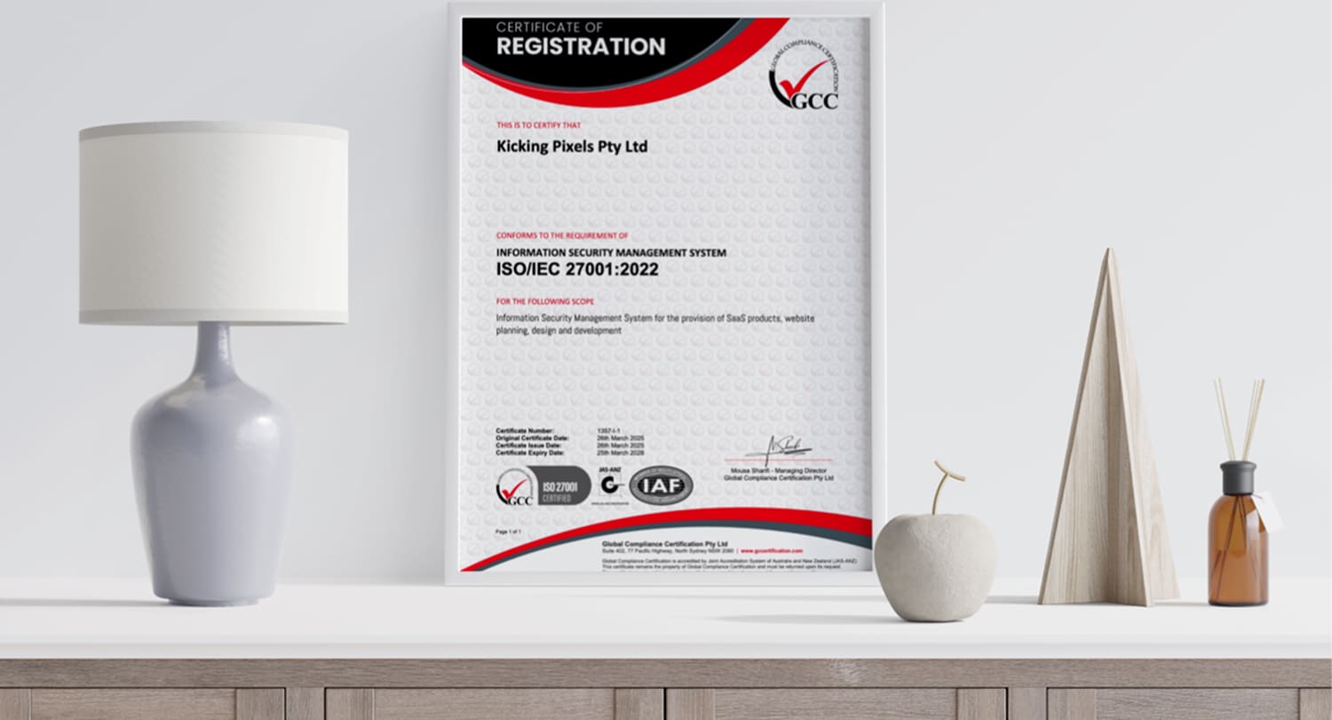 Kicking Pixels ISO 27001 certificate on table